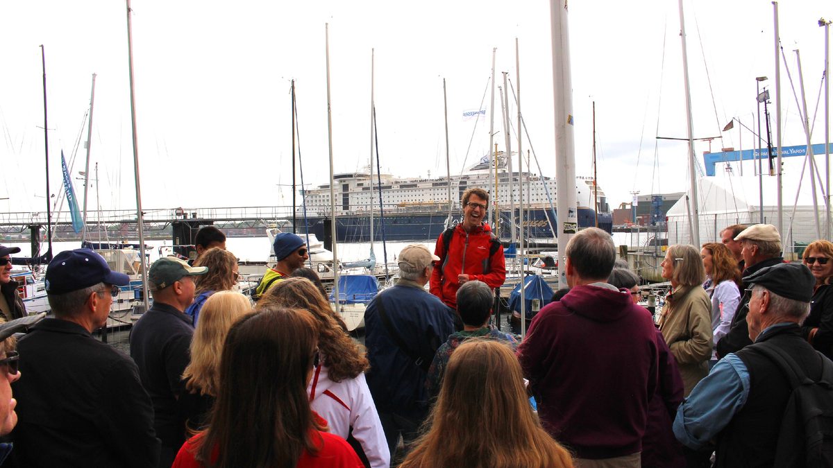 Kirk Wilson leading a walking tour in Kiel harbour